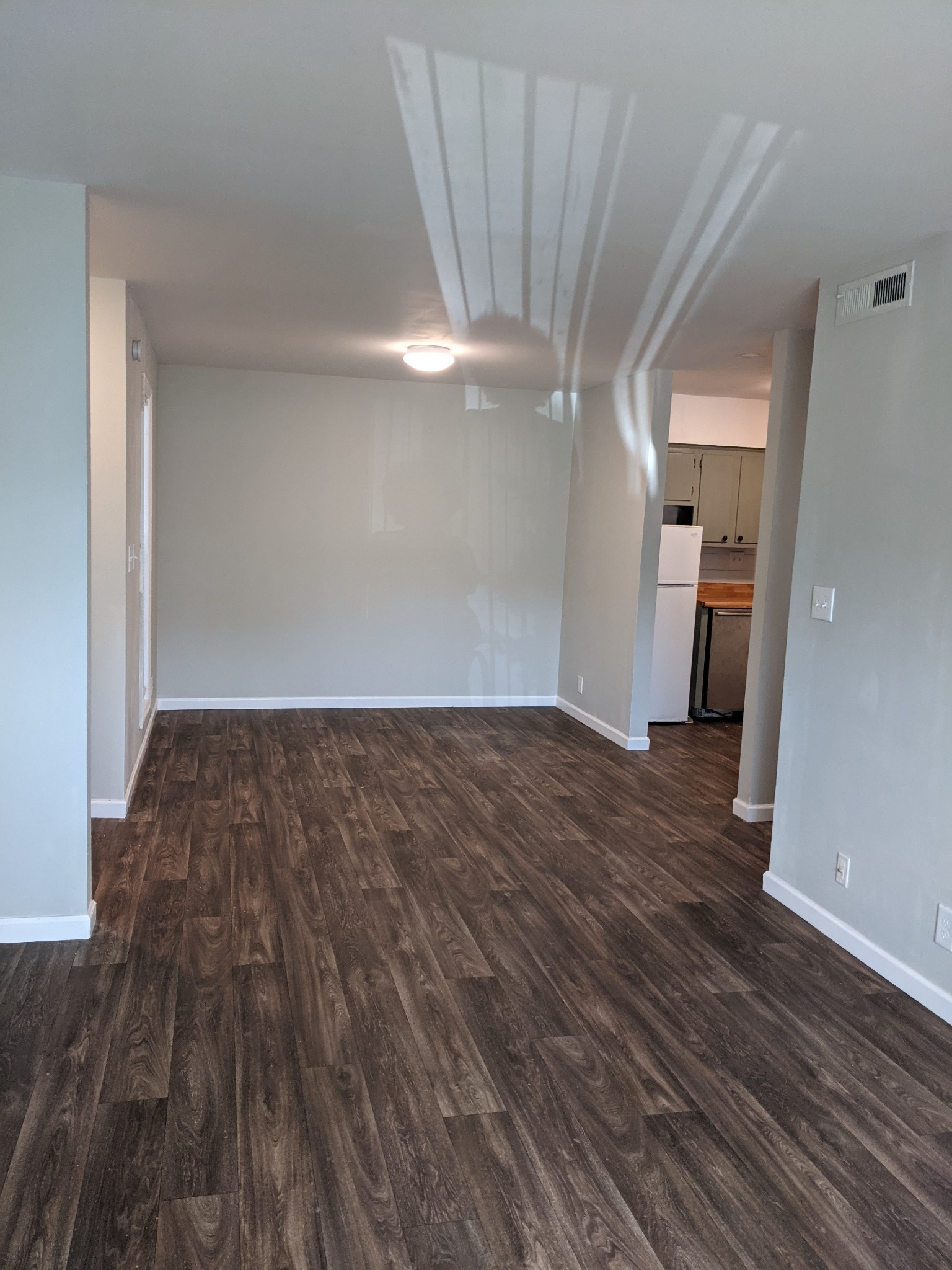 320 Welch Road, Unit F1 Nashville, TN 37211 - Photo 3 of 13 wooden floor in an empty room with a window