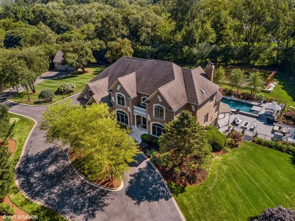 an aerial view of a house with a garden