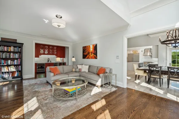 a view of a dining room with furniture large windows and wooden floor