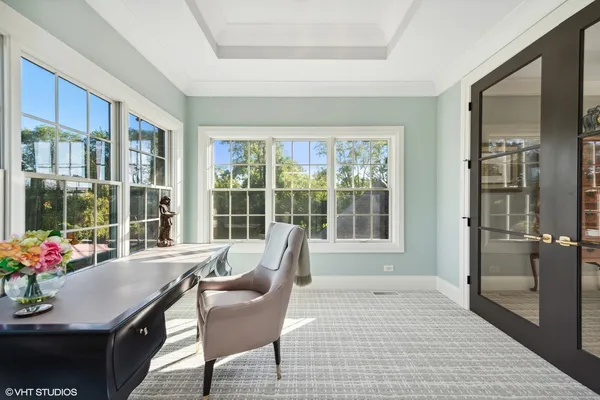 a living room with furniture a walk in closet and a window