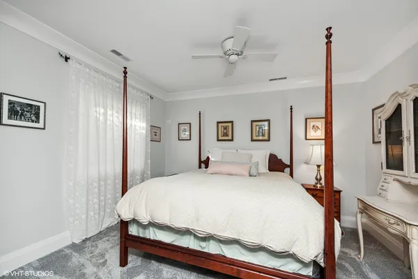 a front view of a house with a yard table and chairs