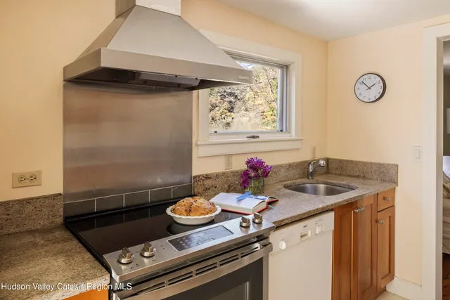 a bathroom with a sink a washer and dryer