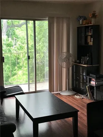 a view of a room with a table and chairs