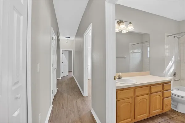a bathroom with a sink and mirror
