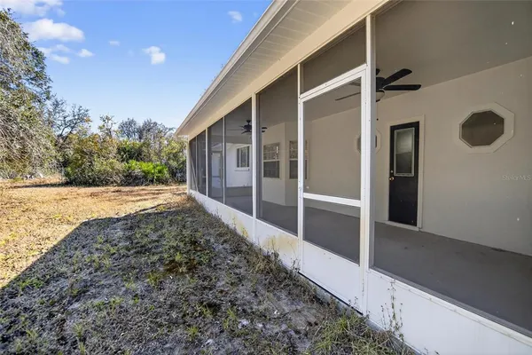 a view of backyard with pathway