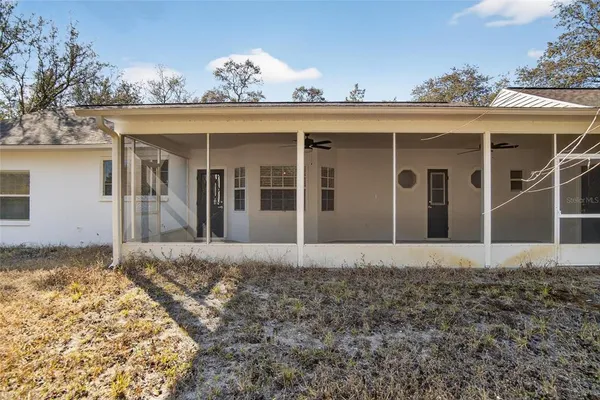 front view of a house with a large window