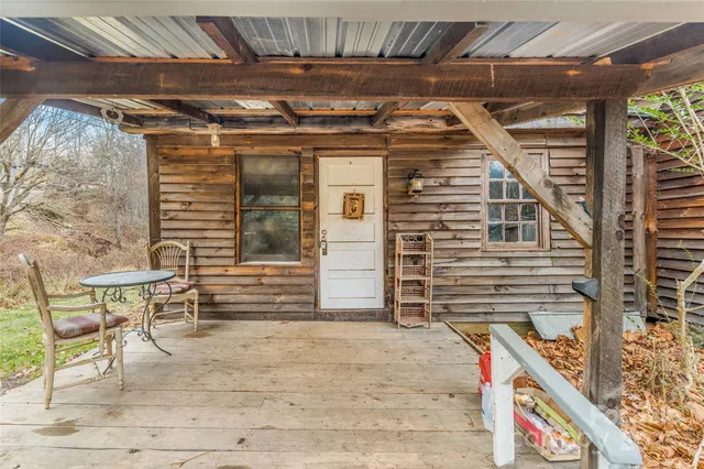 a front view of a house with table and chairs