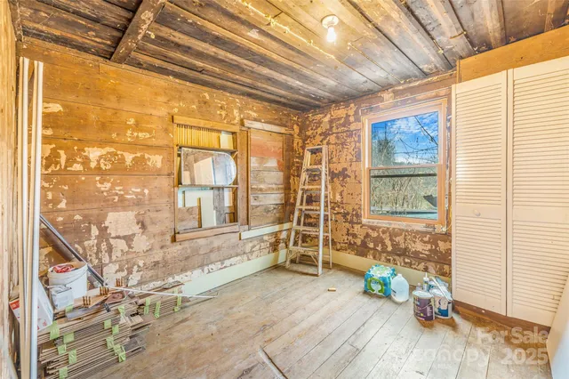 a view of an empty room and a window