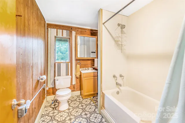 a bathroom with a bathtub a sink and a shower