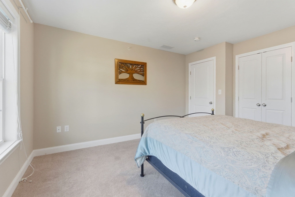 66 Compass Point, Unit 66 North Andover, MA 01845 - Photo 36 of 42 a bedroom with a bed and a window