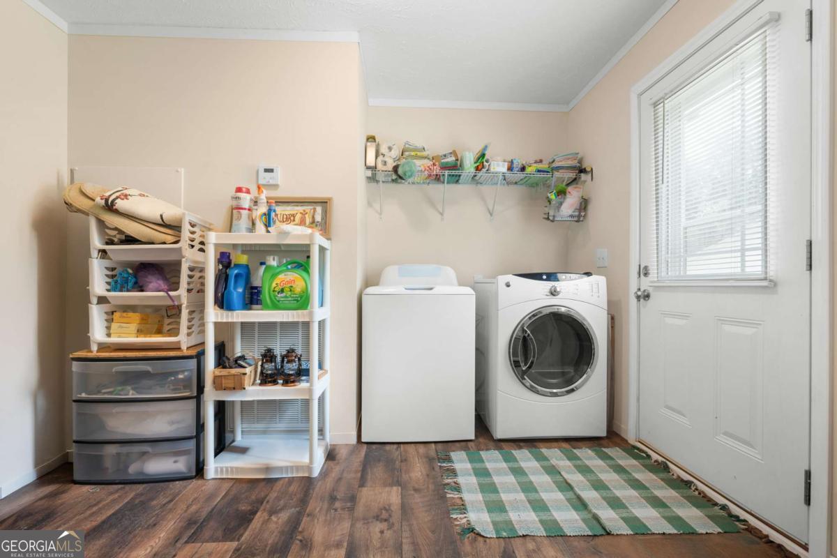 3516 Bennetts Landing Road Millen, GA 30442 - Photo 22 of 34 a utility room with wooden floor washer and dryer