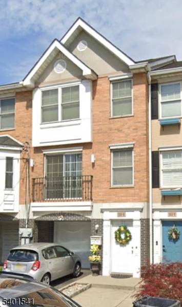 353 Adams Street Newark, NJ 07114 - Photo 15 of 15 a front view of a house with a garage