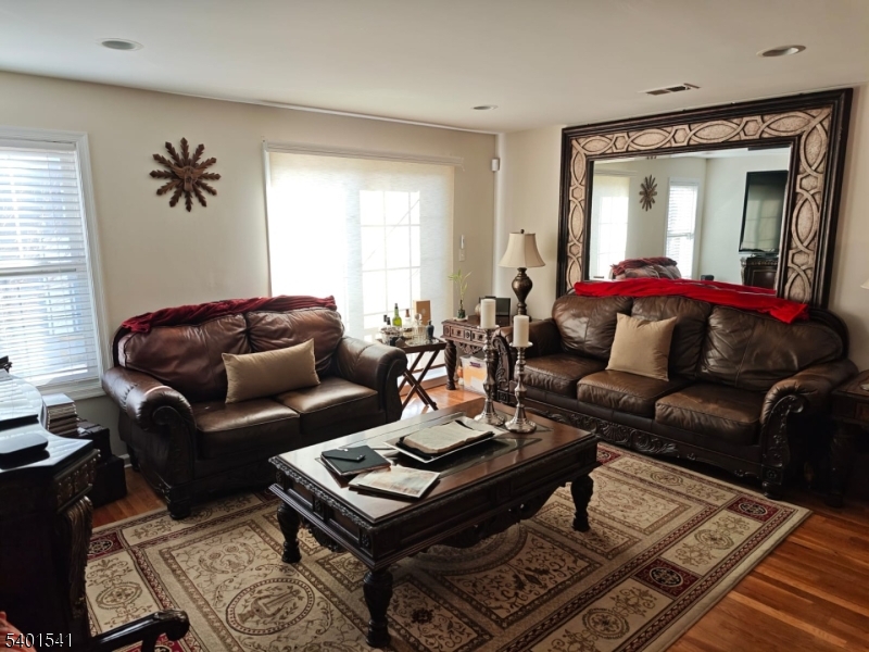 353 Adams Street Newark, NJ 07114 - Photo 3 of 15 a living room with furniture and a window