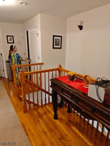 353 Adams Street Newark, NJ 07114 - Photo 5 of 15 a sitting area with furniture and wooden floor
