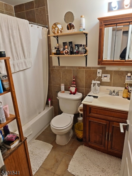 353 Adams Street Newark, NJ 07114 - Photo 6 of 15 a bathroom with a sink toilet and vanity