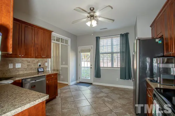 a view of a kitchen with a sink and cabinets