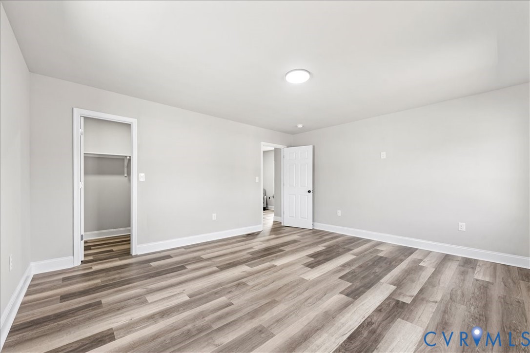 1348 Rome Street Petersburg, VA 23803 - Photo 25 of 45 Unfurnished bedroom with a walk in closet and ligh