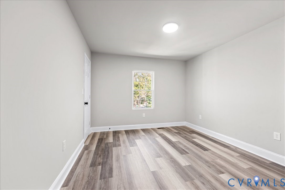 1348 Rome Street Petersburg, VA 23803 - Photo 27 of 45 Empty room featuring light wood-style floors and b