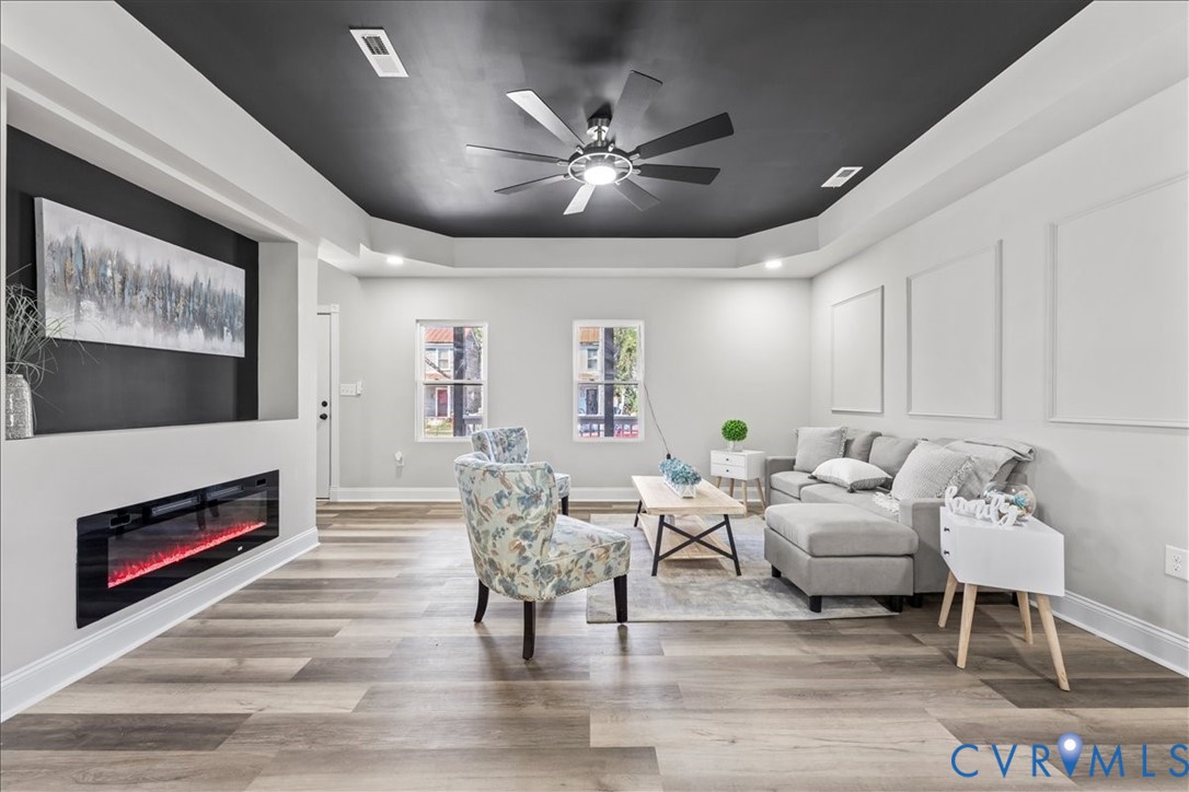 1348 Rome Street Petersburg, VA 23803 - Photo 8 of 45 Living room with light wood-style floors, a raised