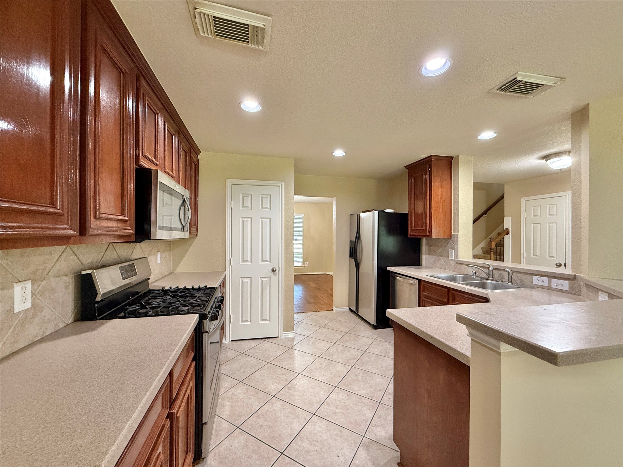1810 Katlyn Lane Spring, TX 77386 - Photo 16 of 48 Kitchen has nice stainless steel appliances