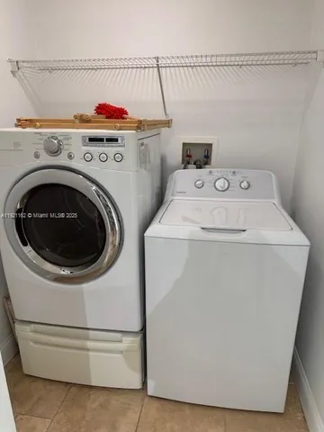 a utility room with dryer and washer