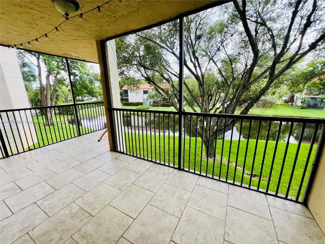 a view of a street view from a balcony