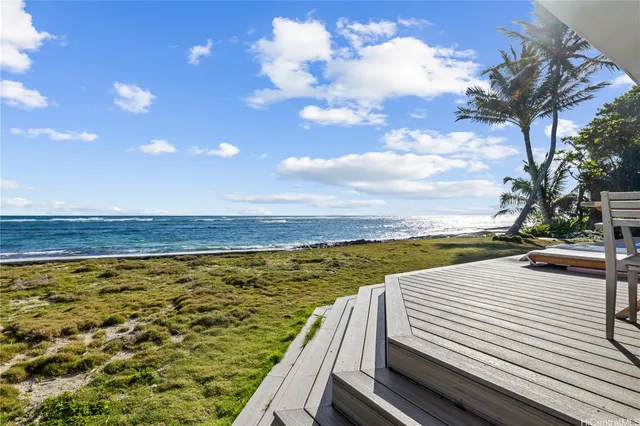 a view of a swimming pool with an ocean view