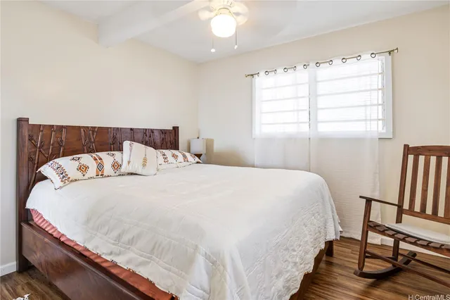 a large white bed in a small room