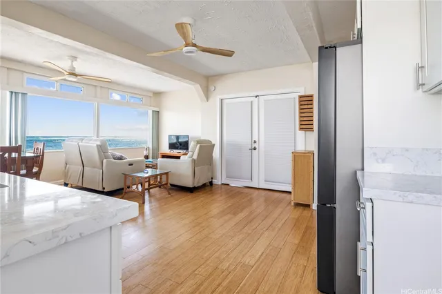 a living room with furniture and a wooden floor
