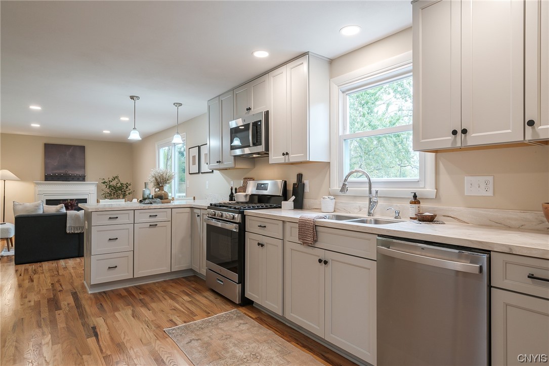 2268 Connell Terrace Lysander, NY 13027 - Photo 6 of 42 KITCHEN OPEN TO THE FAMILY ROOM.... LOADS OF COUNT