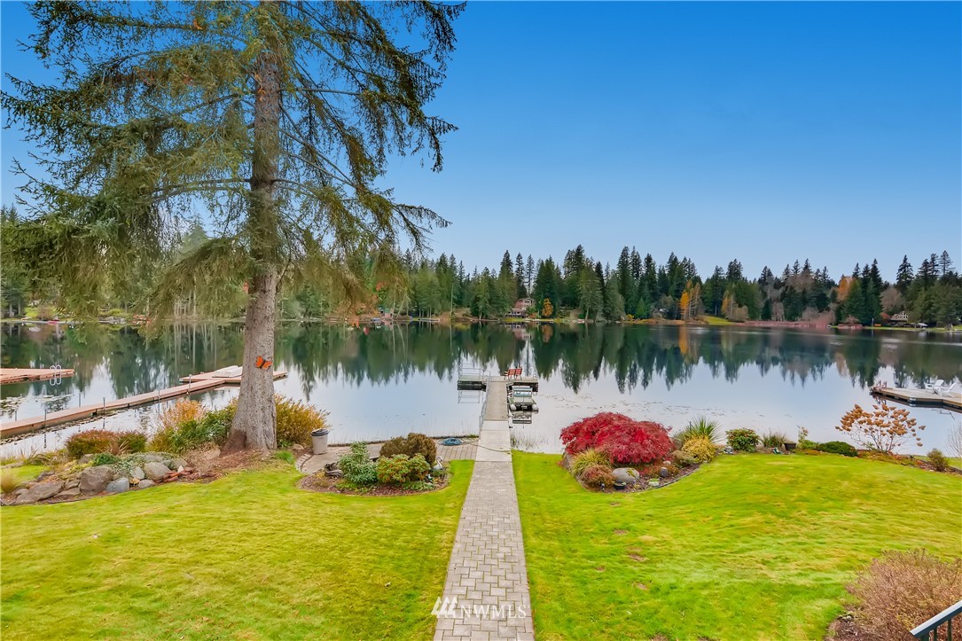 8716 East Lake Cochran Road Monroe, WA 98272 - Photo 2 of 29 a view of a lake with houses in the back