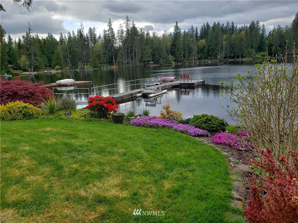 8716 East Lake Cochran Road Monroe, WA 98272 - Photo 17 of 29 a view of swimming pool with a yard