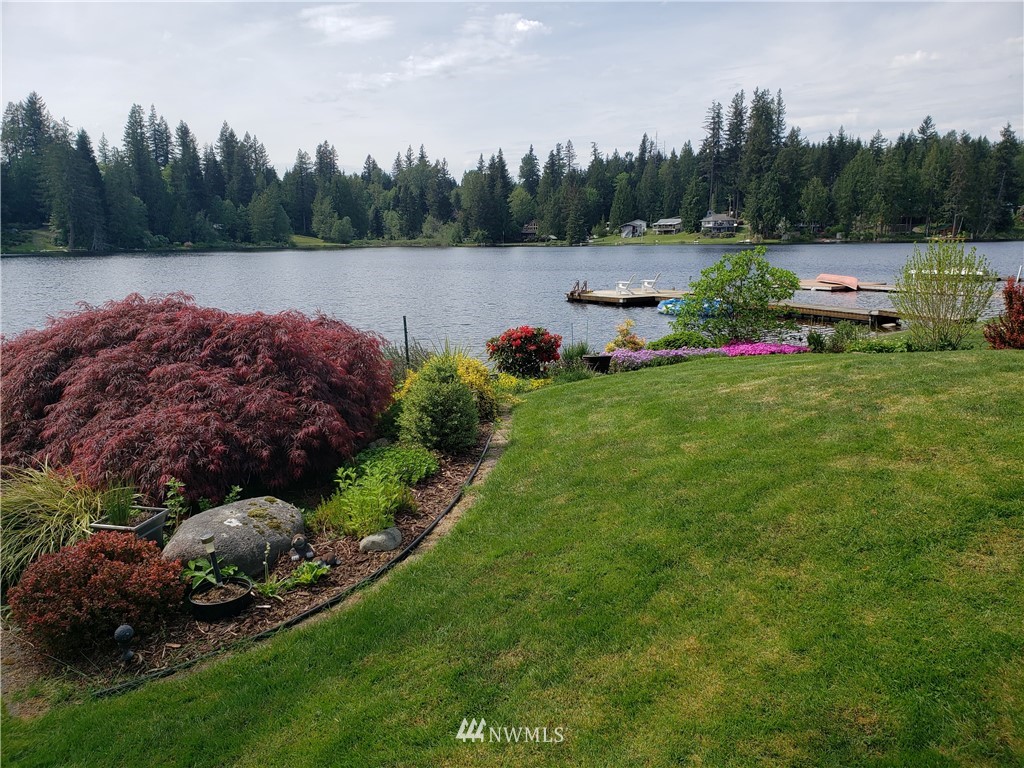 8716 East Lake Cochran Road Monroe, WA 98272 - Photo 18 of 29 a view of a garden with trees