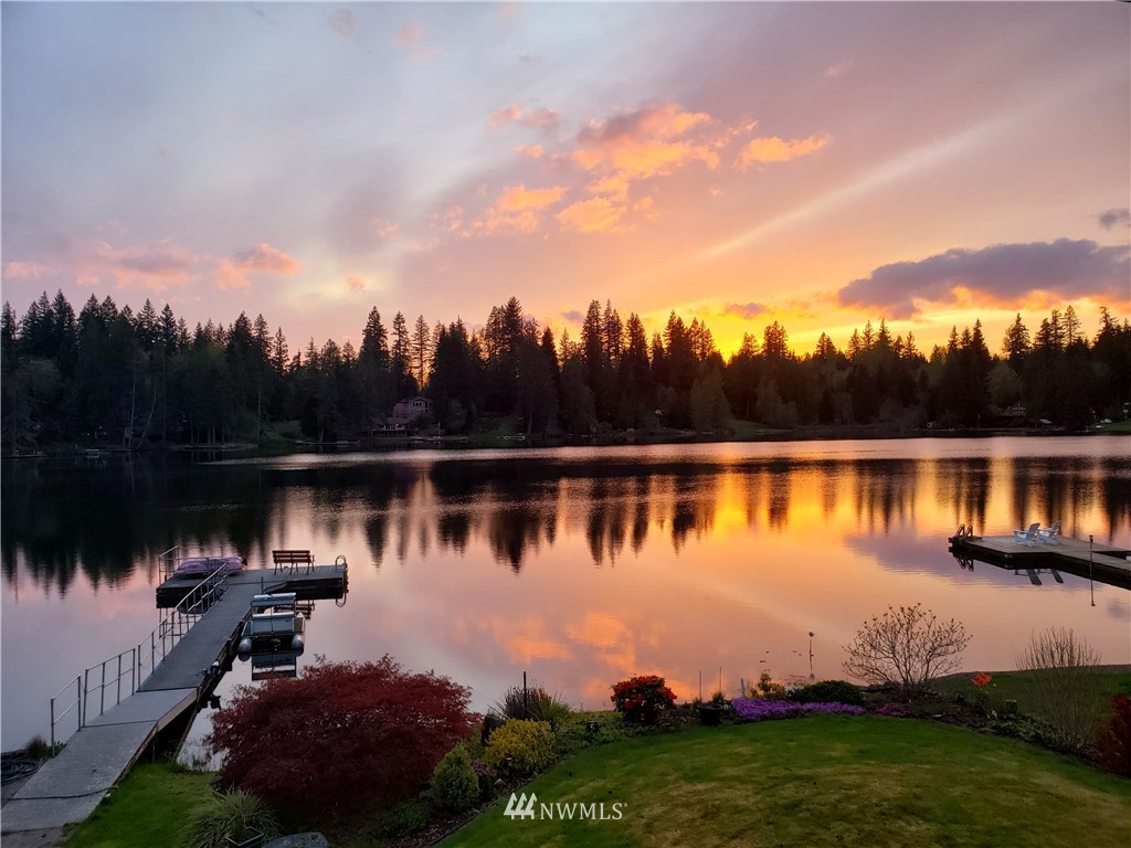 8716 East Lake Cochran Road Monroe, WA 98272 - Photo 21 of 29 a view of a lake with houses in the back