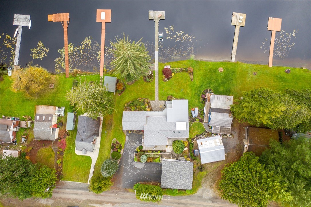 8716 East Lake Cochran Road Monroe, WA 98272 - Photo 22 of 29 a aerial view of a house with a garden and plants