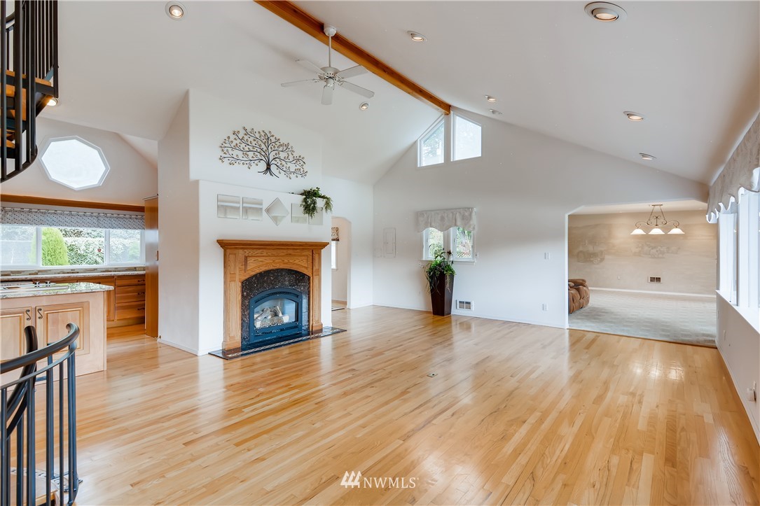 8716 East Lake Cochran Road Monroe, WA 98272 - Photo 5 of 29 a view of a livingroom with a fireplace and window