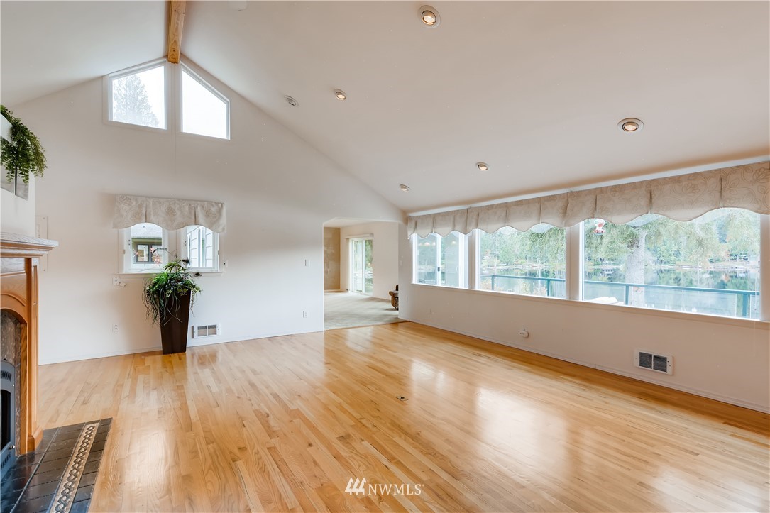 8716 East Lake Cochran Road Monroe, WA 98272 - Photo 6 of 29 a view of empty room with wooden floor and fan