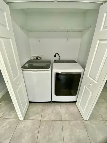 a utility room with washer and dryer