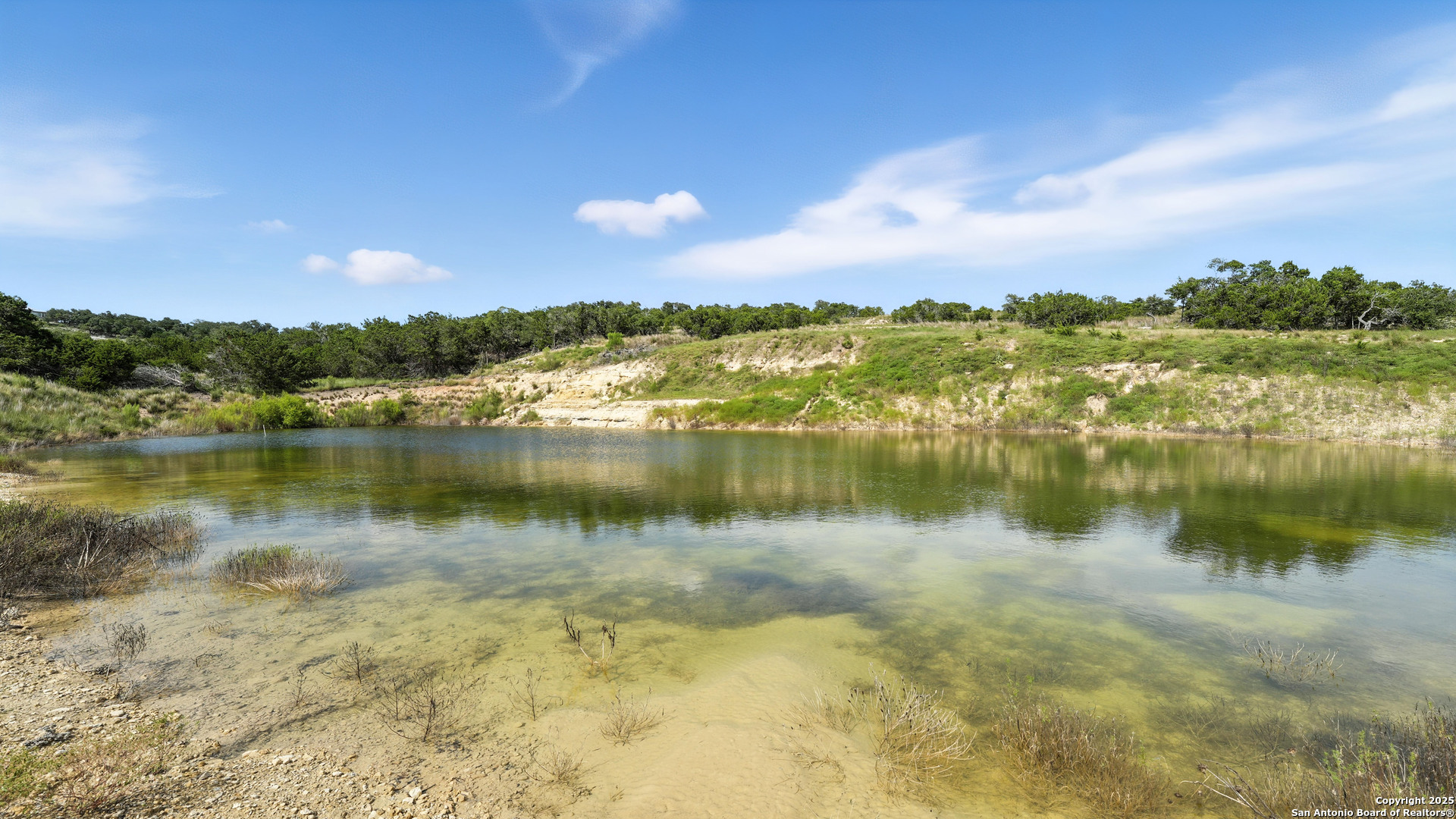 340 West Starview Cove Blanco, TX 78606 - Photo 7 of 25 a view of a lake in middle of a house