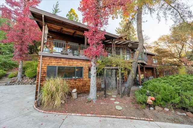 a view of balcony with wooden floor and fence