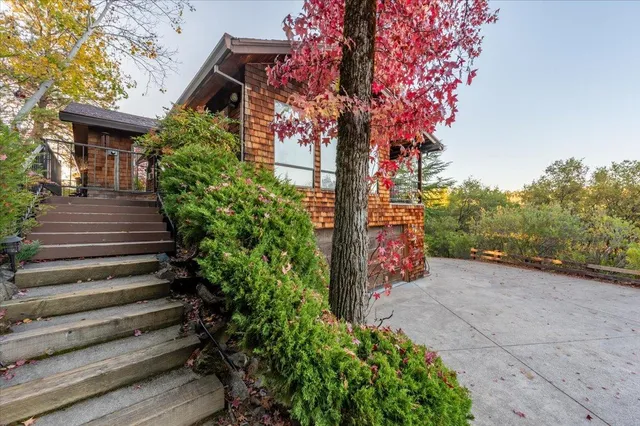 a front view of a house with a garden