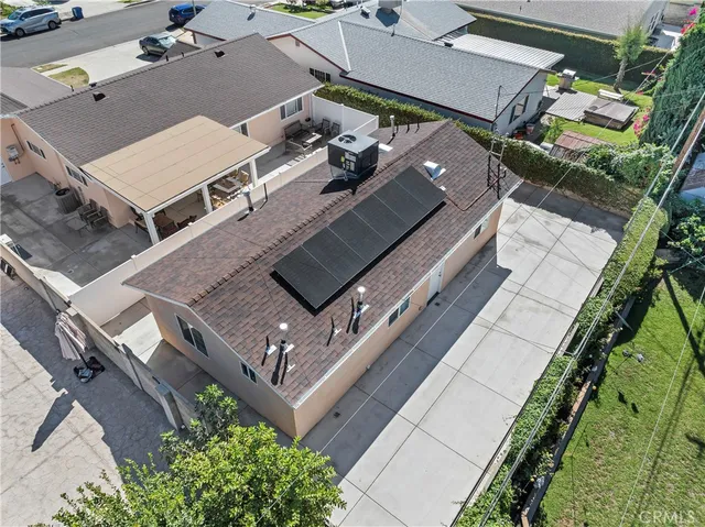 an aerial view of a house with a garden