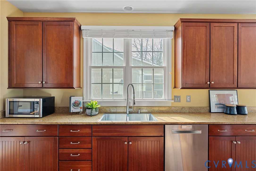 170 Rappa Run Road Topping, VA 23169 - Photo 16 of 60 a kitchen with stainless steel appliances granite countertop a sink a refrigerator and cabinets