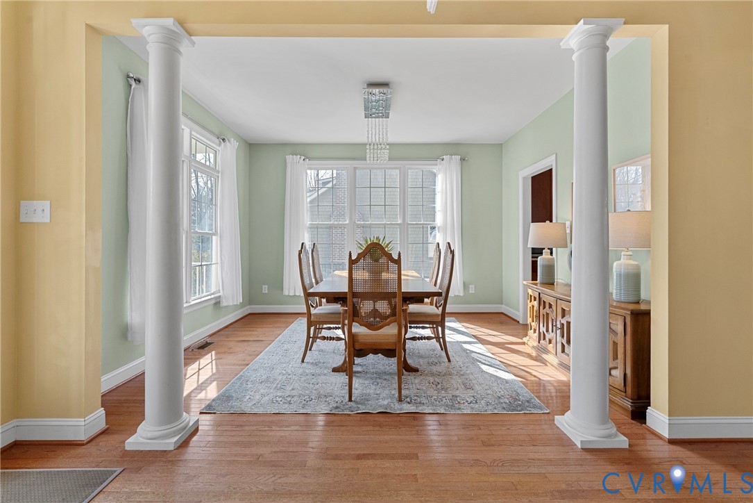 170 Rappa Run Road Topping, VA 23169 - Photo 19 of 60 a dining room with furniture and wooden floor