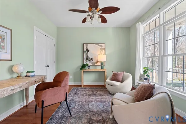 a bedroom with furniture and a window