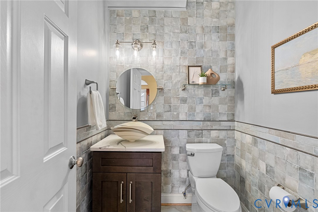 170 Rappa Run Road Topping, VA 23169 - Photo 22 of 60 a bathroom with a sink a toilet and mirror