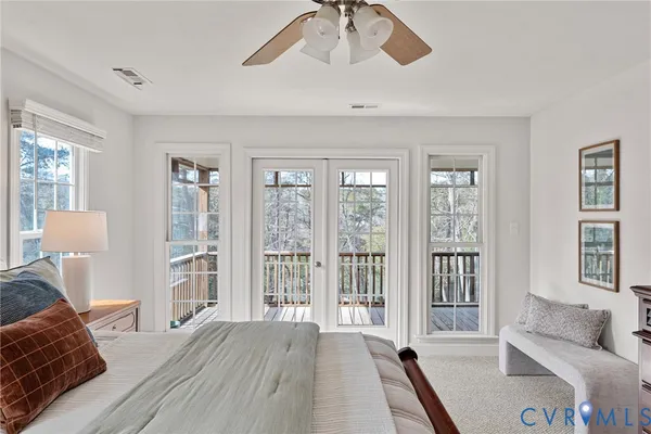 a view of balcony with wooden floor and outdoor seating