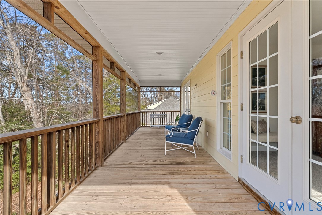 170 Rappa Run Road Topping, VA 23169 - Photo 30 of 60 a view of balcony with wooden floor and outdoor seating