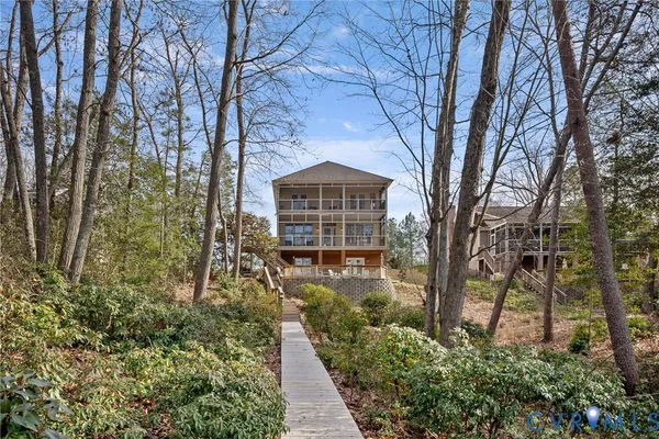 a wooden pier with boats in a lake