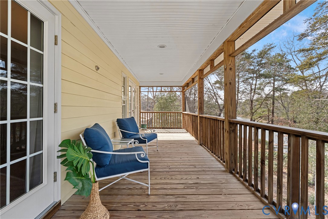170 Rappa Run Road Topping, VA 23169 - Photo 33 of 60 a view of balcony with wooden floor and outdoor seating